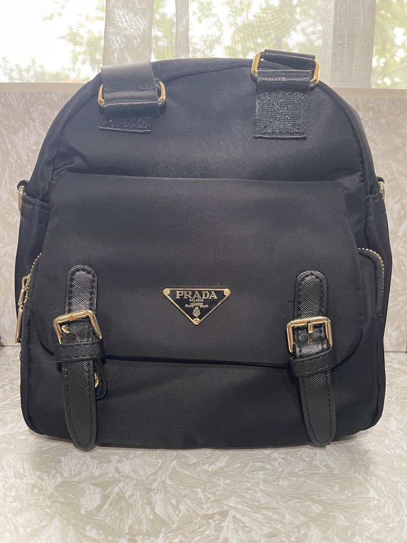 Prada Nylon Backpack Black Gold Hardware (Category: Backpacks) located in Quezon City. Submitted by miggyxz (Listing ID 1447203975, Image 1). Description: - Authentic Prada nylon backpack - Elegant gold hardware details - Front pocket with buckle straps - Adjustable shoulder straps for comfort - Classic Prada triangle logo - Ideal for everyday use or travel NO REFUND POLICY‼️ All sales are final. Please review your order carefully before completi