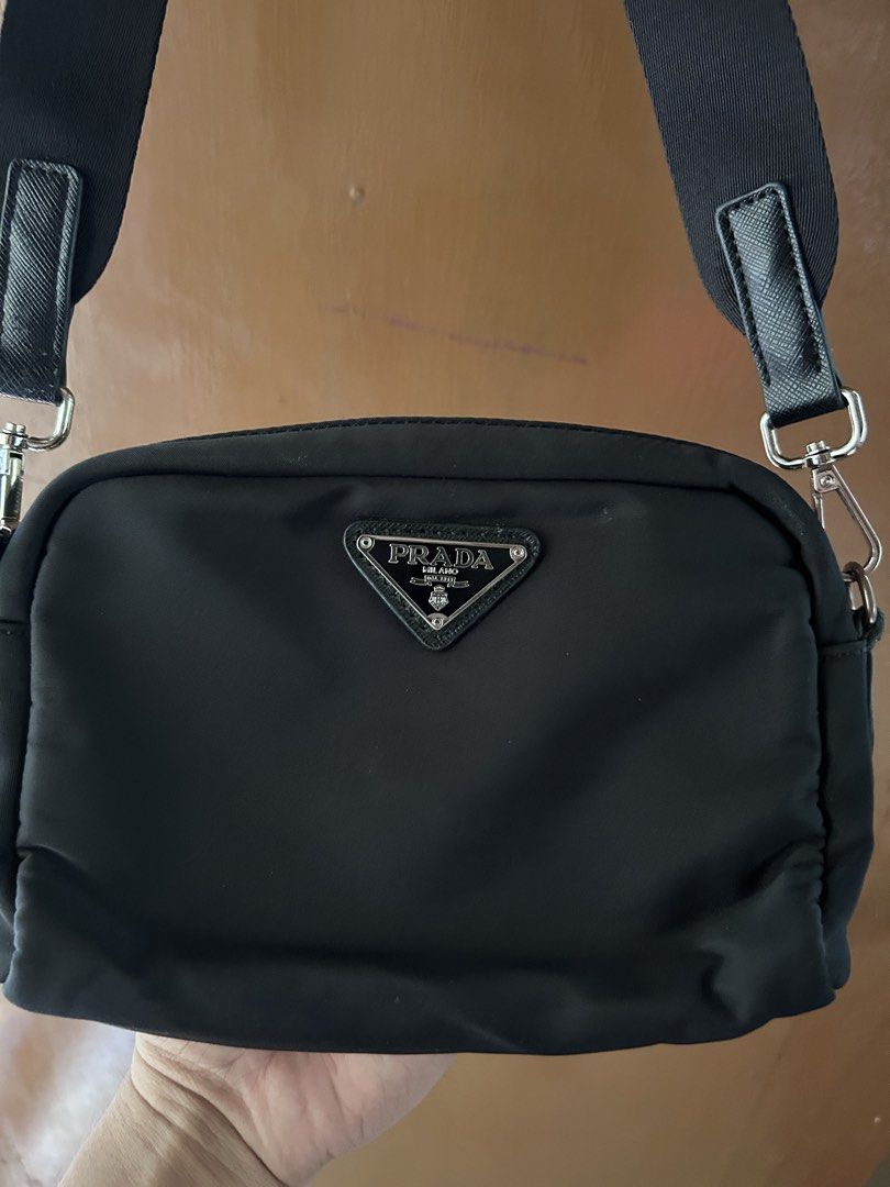 Prada Nylon Crossbody Bag Black (Category: Luxury Bags & Wallets) located in Dipolog. Submitted by adrian281994 (Listing ID 1447132432, Image 2). Description: - Black Prada Nylon Crossbody Bag Kasya wallet cellphone - Adjustable strap for comfortable wear - Secure zipper closure - Compact size, perfect for carrying essentials - Elegant silver hardware details - Modern and sleek design - Versatile for everyday use.