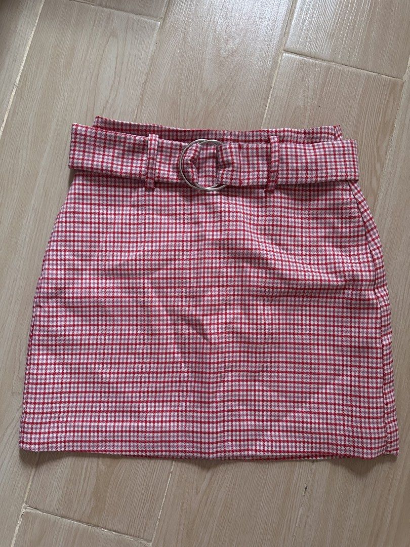 Pull & Bear Red Plaid Mini Skirt with Belt (Category: Skirts) located in Antipolo. Submitted by waco1313 (Listing ID 1446755841, Image 3). Description: - Cute red and white plaid mini skirt - Includes matching belt with silver buckle - Zipper closure at the back - Versatile for casual or night out looks.