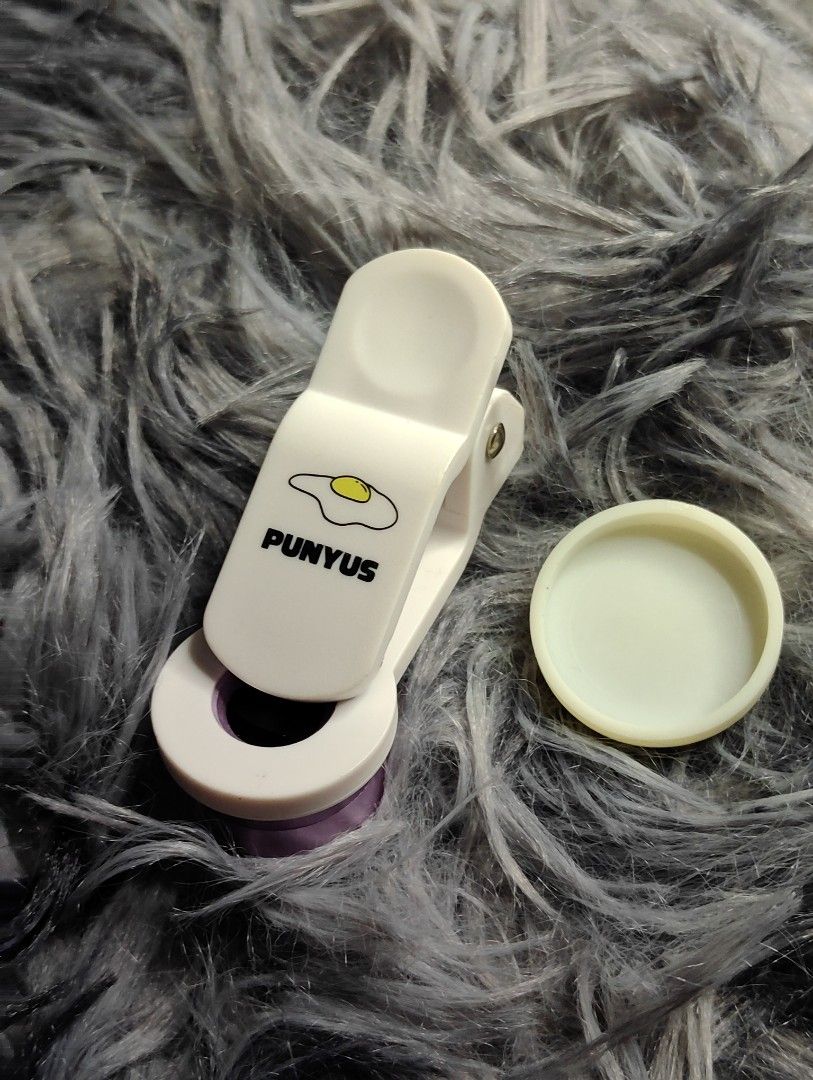 PUNYUS Clip-on Phone Camera Lens with Cap (Category: Cameras) located in Pasig City. Submitted by hazelscollectibles (Listing ID 1447282368, Image 2). Description: - PUNYUS clip-on lens for your phone camera. - Comes with a protective cap. - Ideal for taking different kinds of photos. - Easy to attach and remove..