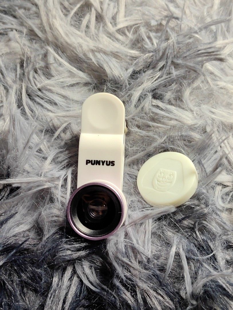 PUNYUS Clip-on Phone Camera Lens with Cap (Category: Cameras) located in Pasig City. Submitted by hazelscollectibles (Listing ID 1447282368, Image 1). Description: - PUNYUS clip-on lens for your phone camera. - Comes with a protective cap. - Ideal for taking different kinds of photos. - Easy to attach and remove..