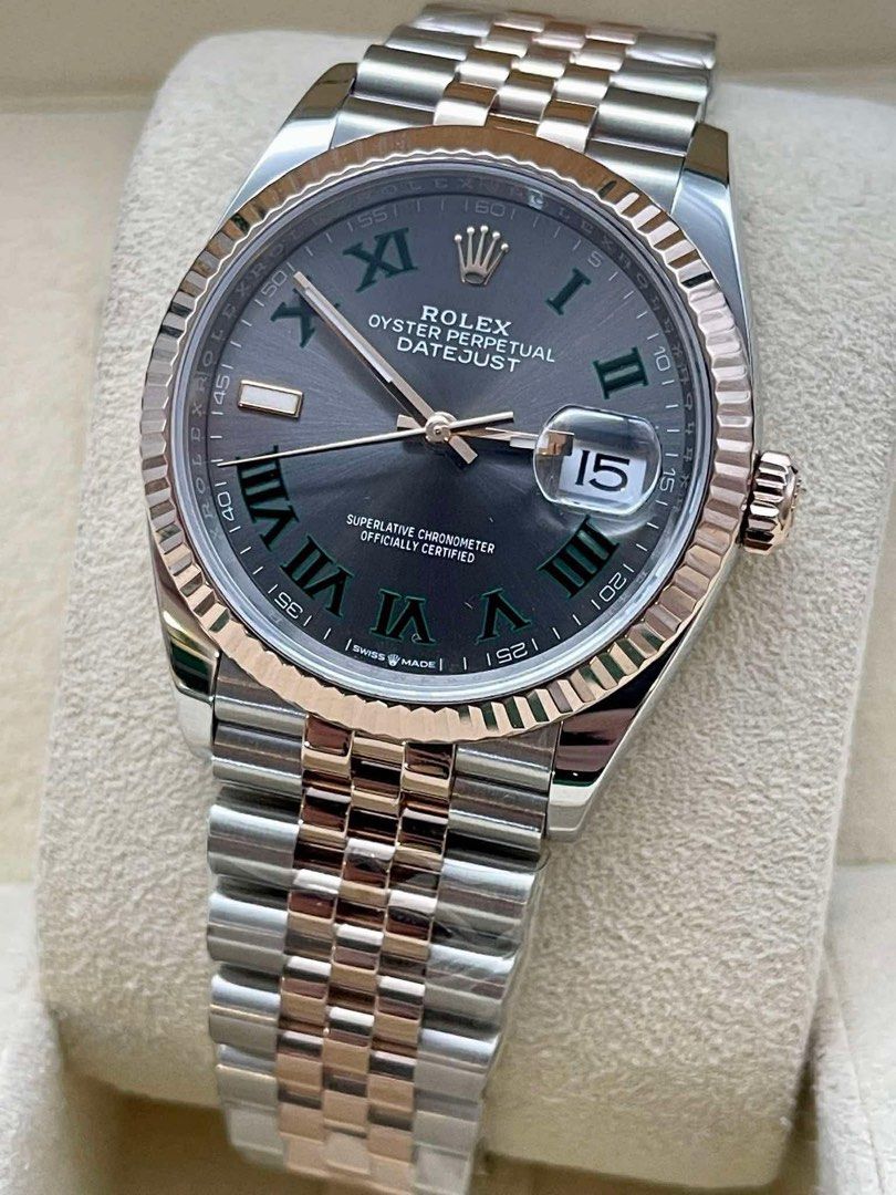 DATEJUST 36 WHIMBLEDON TWO TONE RG. (Category: Luxury Watches) located in Manila. Submitted by watchesbyjamesdy (Listing ID 1447185749, Image 2). Description: - Rolex Oyster Perpetual Datejust - Two-tone stainless steel and rose gold construction - Elegant grey dial with Roman numeral hour markers - Iconic fluted bezel - Comfortable Jubilee bracelet - Reliable automatic movement - Convenient date window at 3 o'clock - A timeless and classic timep