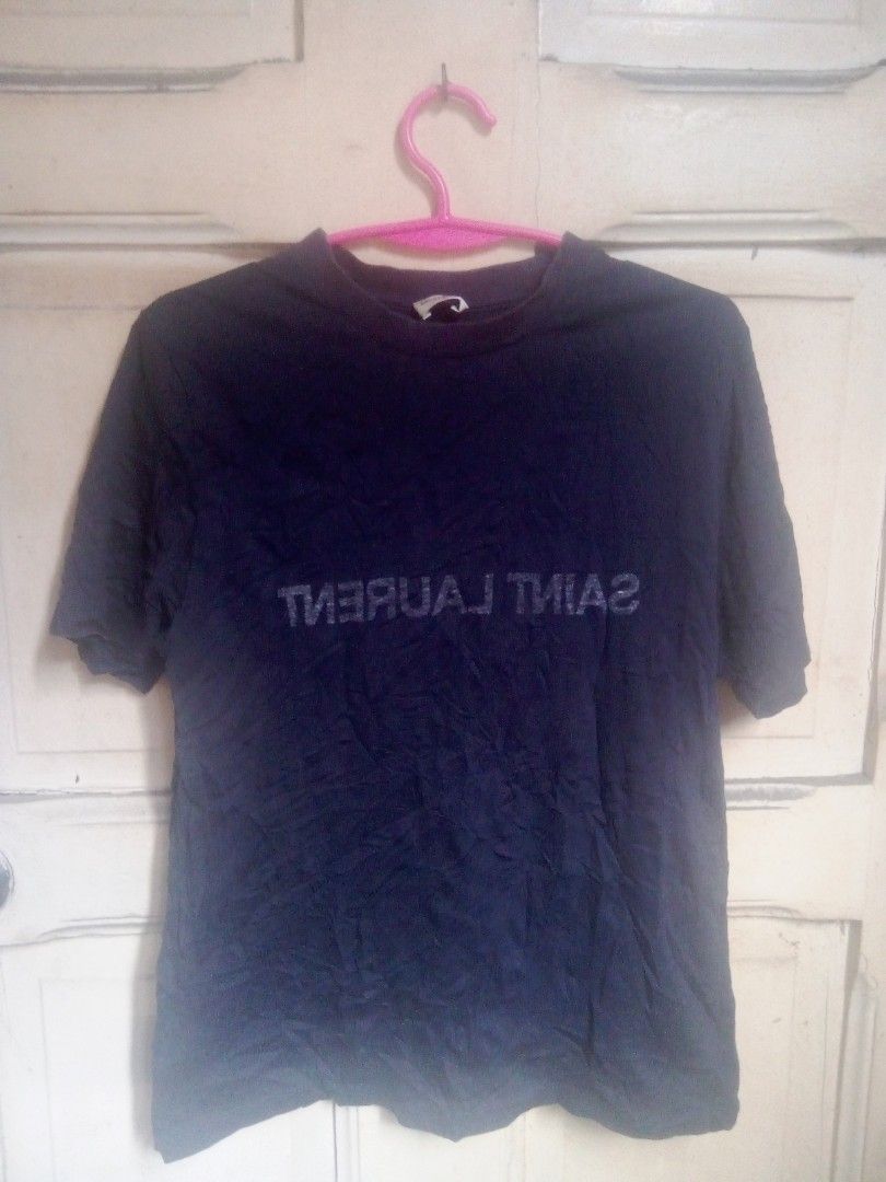 SAINT LAURENT REVERSE LOGO PRINT TEE (Category: Luxury Apparel) located in Manila. Submitted by mnla.thriftshop (Listing ID 1447154332, Image 1). Description: SAINT LAURENT MIRROR TEE excellent condition 999php 20.5 INCHES WIDTH 26 LENGTH DIRECT MESSAGE 📥🙏.