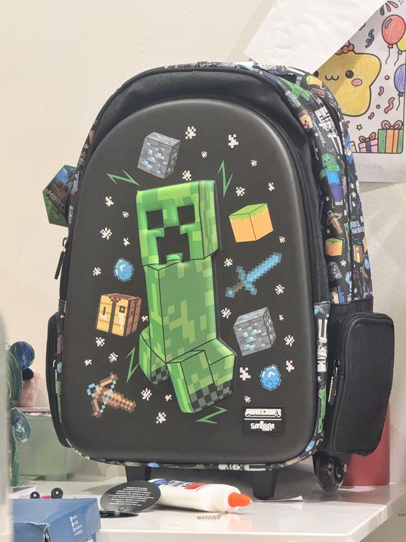 Smiggle Limited ed. Minecraft Rolling Backpack (Category: Backpacks) located in Las Pinas. Submitted by marcovc (Listing ID 1447162098, Image 2). Description: - Authentic Smiggle rolling backpack - BRAND NEW NEVER USED WITH TAGS - Equipped with wheels and a retractable handle for easy carrying RFS: trolley bags not allowed sa school.