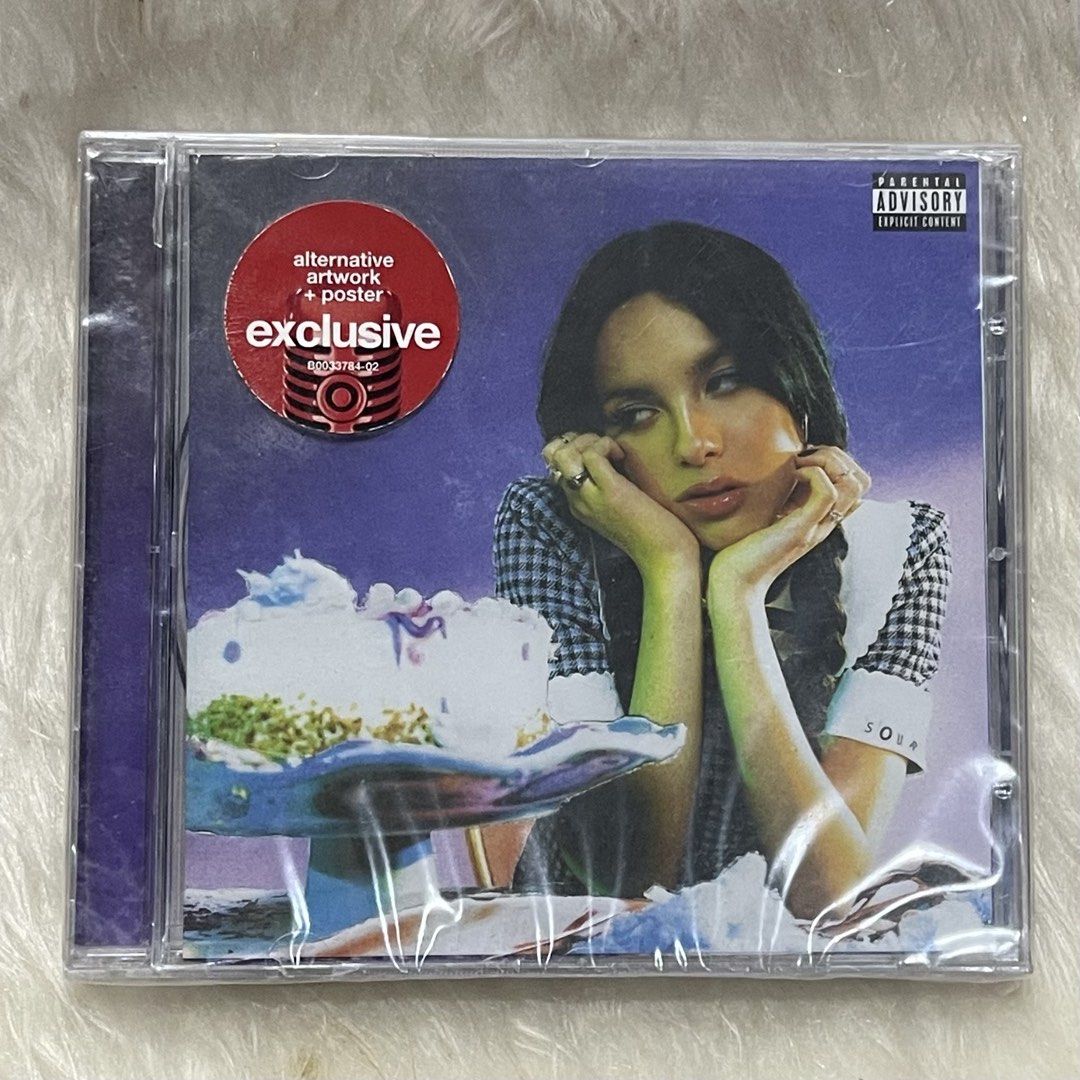 SOUR (Target Exclusive) CD- Olivia Rodrigo (Category: CDs & DVDs) located in Minalin. Submitted by blinklivie17 (Listing ID 1447166137, Image 1). Description: Brand New & Sealed Authentic Issue: Minimal Back Cracked .