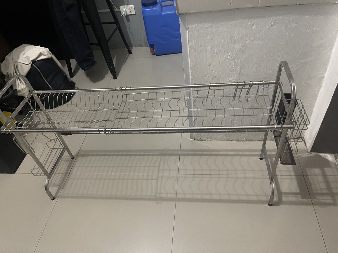 Stainless Steel Dish Rack with Draining Tray (Category: Other Kitchenware & Tableware) located in Del Monte. Submitted by mhinaesguerra (Listing ID 1447133505, Image 2). Description: - Made of durable stainless steel - Multiple tiers for ample drying space - Separate tray to catch water drips - Sturdy construction for stability - Easy to assemble - Perfect for organizing your kitchen sink area.