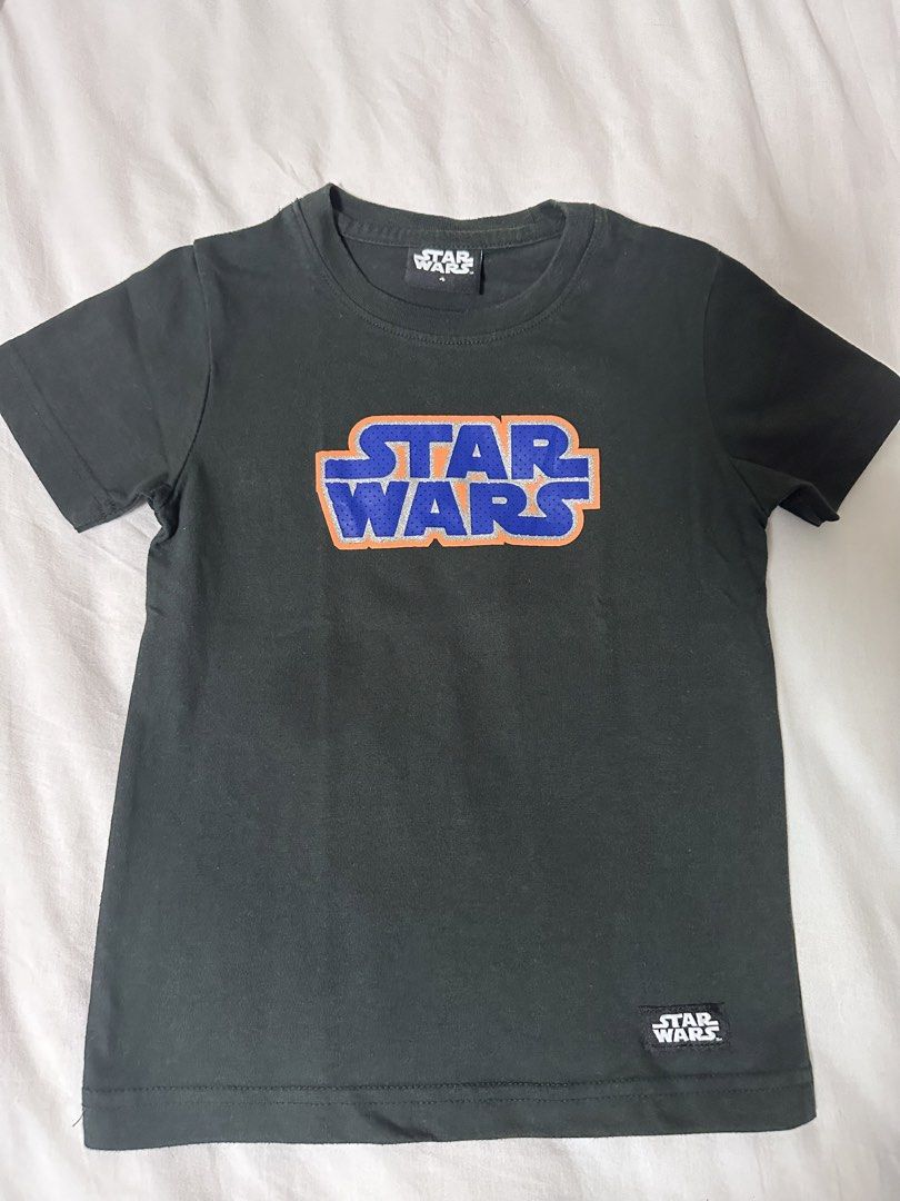 Star Wars Kids T-shirts - Size 4 (Category: Babies & Kids Fashion) located in Makati City. Submitted by Pipie (Listing ID 1447287698, Image 3). Description: Take all 4 for ₱1100 - Bundle of 4 Star Wars t-shirts for kids - All size 4 - Designs include: black with camouflage logo, black with blue and orange logo, and blue with stormtrooper graffiti and white with comics design - Ideal for any young Star Wars enthusiast.