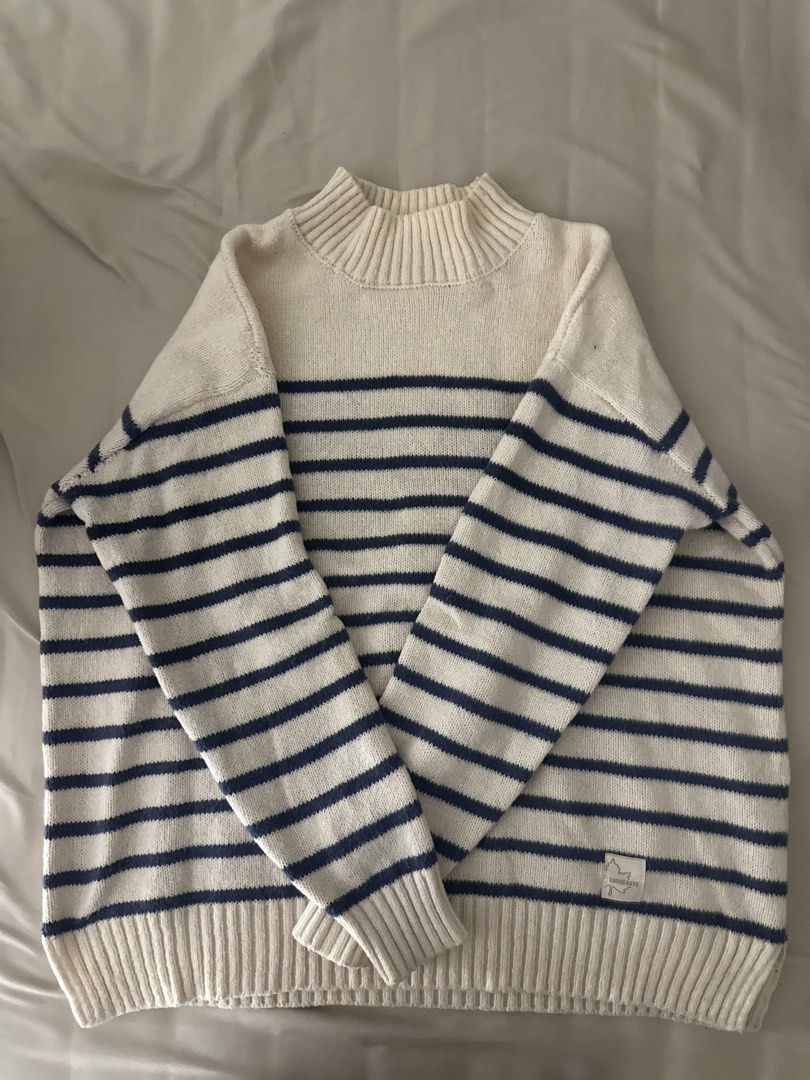 Striped Mock Neck Sweater (Category: Longsleeves) located in Seri Kembangan. Submitted by arinahanz (Listing ID 1447131422, Image 1). Description: -pit24 labuh25 - Cream and navy striped pattern - Stylish mock neck design - Cozy knit material for ultimate comfort - Ribbed cuffs and hem for a snug fit - Features a small leaf logo tag on the side - Versatile for layering or wearing solo.