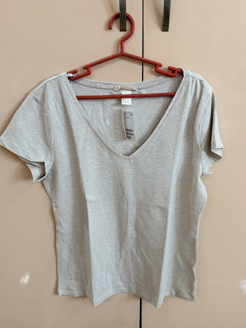 TAKE ALL! H&M Basic V-Neck & Round Neck T-Shirts (3 Colors) (Category: Shirts) located in Manila. Submitted by emskyeclaire (Listing ID 1447261643, Image 2). Description: - Bundle of 3 H&M basic tees - Colors: Beige (V-neck), Light Blue (V-neck), Peach (Round Neck) - Sizes: M to L - Perfect for everyday wear - Great value bundle!.