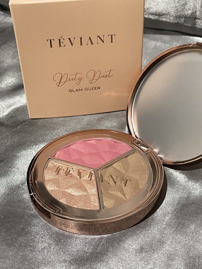 TEVIANT Deity Dust Glam Queen Face Palette (Category: Makeup) located in Cavite. Submitted by nobueno_ (Listing ID 1447240045, Image 1). Description: - Teviant Deity Dust Face Palette - SWATCHED ONLY - Shade: Glam Queen - Includes: 1 Blush, 1 Bronzer, 1 Highlighter - Features: Rose gold compact with mirror - Benefit: Adds a beautiful glow to your makeup look - Reason for Selling: I realized it’s not my shade .