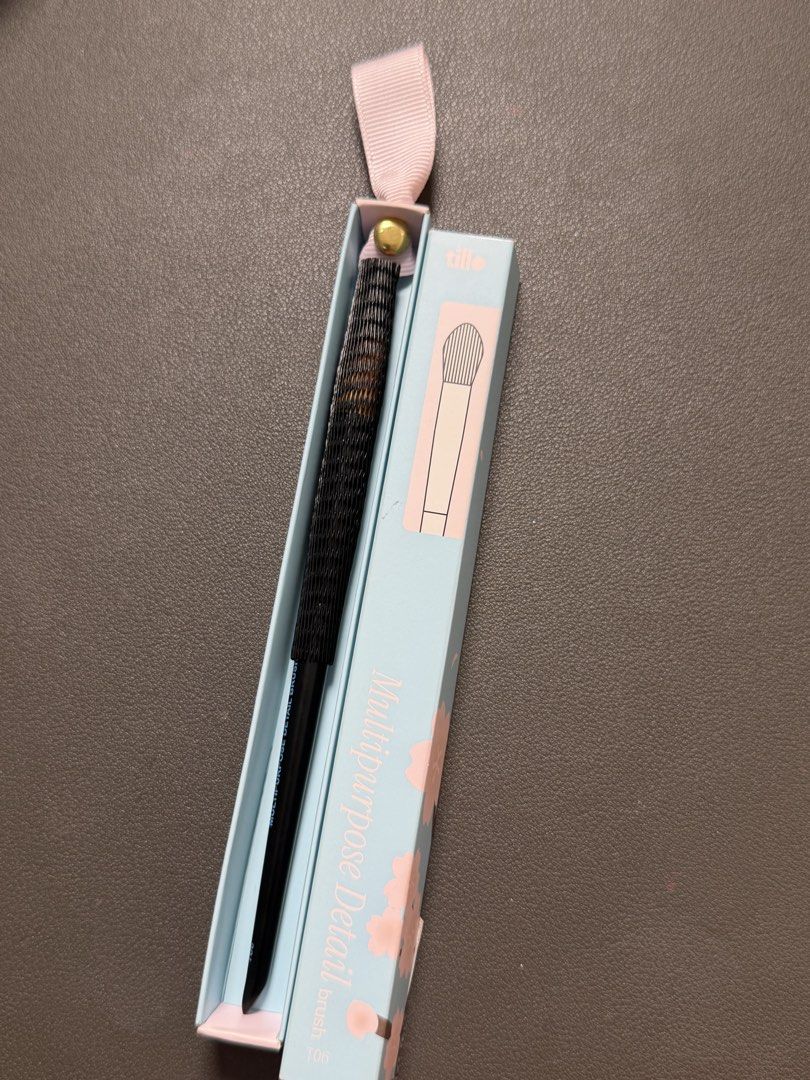 TILLO Multipurpose Detail Brush T06 (Category: Makeup) located in Manila. Submitted by declutterreset.ry (Listing ID 1447257243, Image 3). Description: - T06 multipurpose detail brush - Original packaging with cute cherry blossom design - Black handle with blue text - Ideal for detailed makeup application - Selling because it's no longer needed.