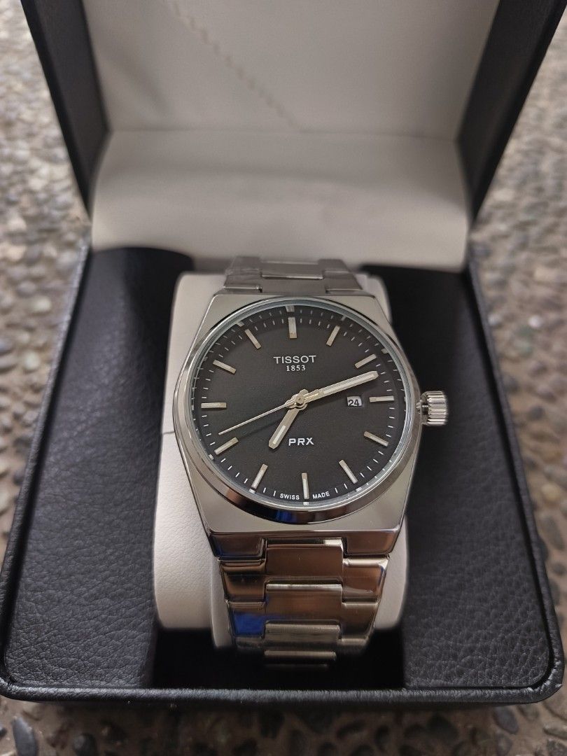 Tissot PRX Watch 1:1 (Category: Luxury Watches) located in Caloocan City. Submitted by seiji09723 (Listing ID 1446086171, Image 3). Description: - Tissot PRX watch - Stainless steel bracelet - Dark grey dial with date window - Includes original box and Tissot shopping bag - Versatile for everyday or special occasions.