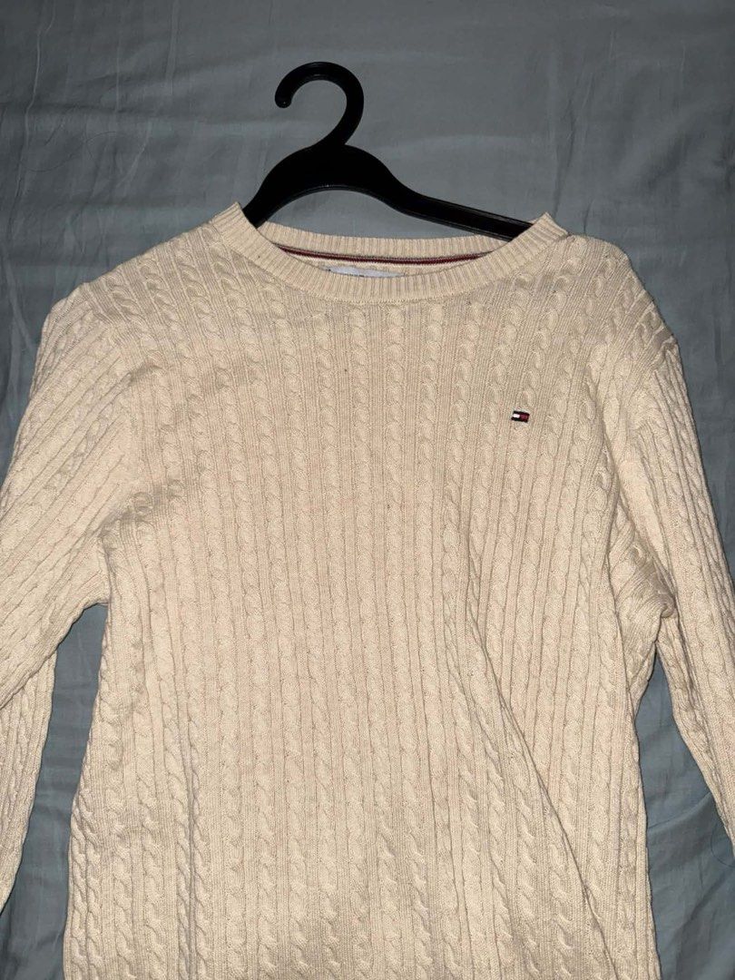 Tommy Hilfiger Cream Cable Knit Sweater (Category: Longsleeves) located in Taguig. Submitted by _pattyp (Listing ID 1447288251, Image 2). Description: - Brand: Tommy Hilfiger - Color: Cream - Style: Cable knit sweater - Features: Long sleeves, ribbed cuffs and hem, small chest logo - Versatile: Great for layering or wearing on its own.