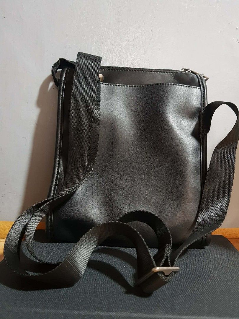 Tumi Black Leather Crossbody Bag (Category: Luxury Bags & Wallets) located in Binan City. Submitted by grandcat_2 (Listing ID 1447154475, Image 2). Description: Tumi crossbody bag in smooth black leather with refined detailing. Features the iconic Tumi logo, sturdy branded zippers, and multiple pockets for easy organization. Sleek, professional, and durable—ideal for work, travel, or daily use. A timeless piece that adds instant sophistication to