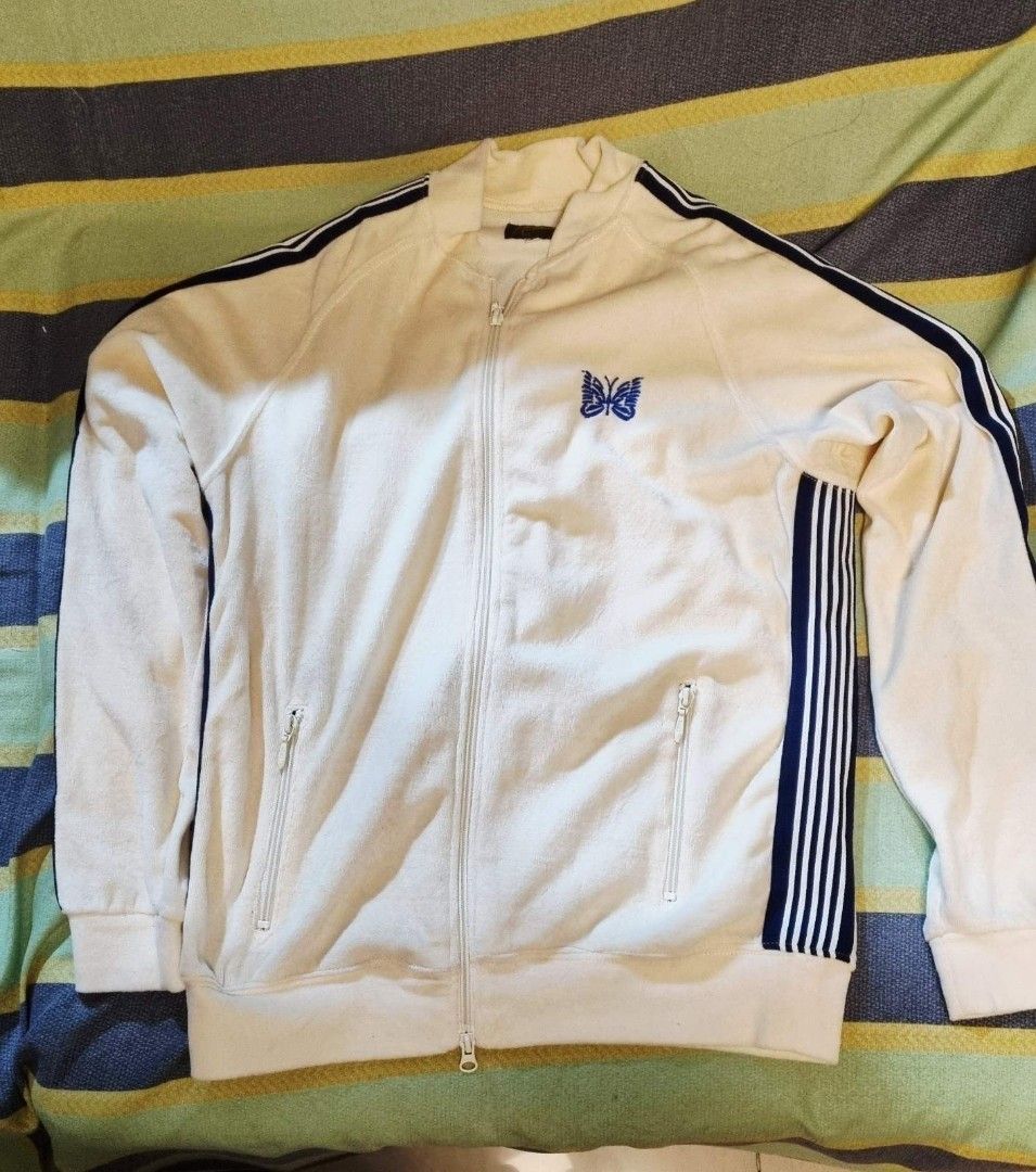 Velour Track Jacket (Category: Coats, Jackets and Outerwear) located in Quezon City. Submitted by apspc (Listing ID 1447293369, Image 2). Description: - Cream Velour Track Jacket - Iconic butterfly logo on chest - Soft, velour-like material - Zippered pockets for convenience - Striped detailing on sleeves and sides - Size: S - Made in Japan Price is still negotaible but please don't haggle too low. Payment mode: GCash.