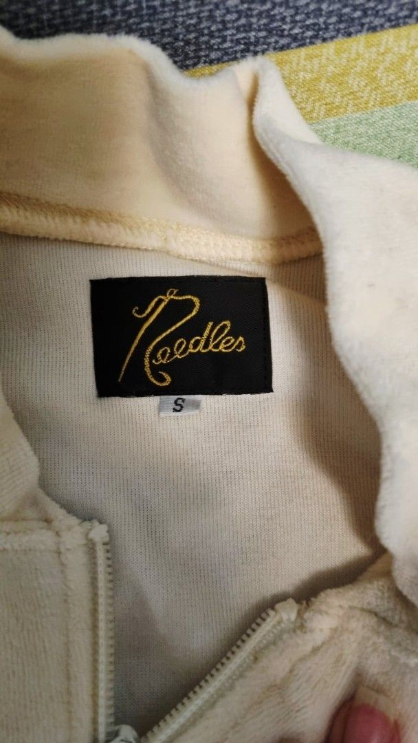 Velour Track Jacket (Category: Coats, Jackets and Outerwear) located in Quezon City. Submitted by apspc (Listing ID 1447293369, Image 1). Description: - Cream Velour Track Jacket - Iconic butterfly logo on chest - Soft, velour-like material - Zippered pockets for convenience - Striped detailing on sleeves and sides - Size: S - Made in Japan Price is still negotaible but please don't haggle too low. Payment mode: GCash.