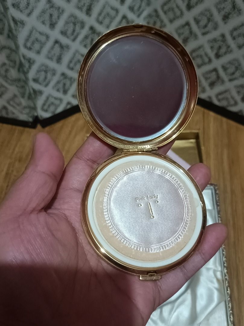 Vintage Pink Lady Powder Compact with Case (Category: Makeup) located in Makati City. Submitted by nyxhemera26 (Listing ID 1447290421, Image 3). Description: Vintage Pink Lady powder compact - Features a black and gold fan pattern on the lid - Comes with original box and satin lining - Mirror is clear - Original powder puff and paper insert included - Ideal collectible for vanity display 📍PLEASE DO NOTE THAT BOX IS NO LONGER IN VERY GOOD CONDITI