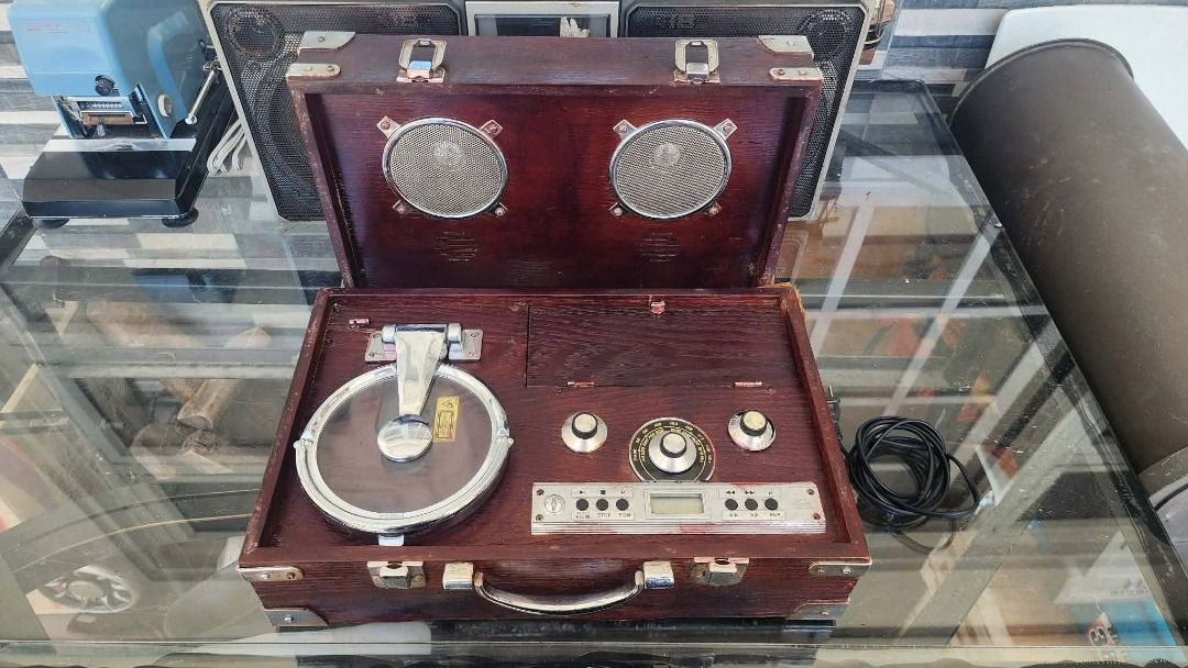 Vintage Portable Record Player Suitcase (Category: Portable Music Players) located in Luna. Submitted by joelrilloraza (Listing ID 1447262214, Image 3). Description: - Retro suitcase-style record player - Plays cd records - Built-in speakers for easy listening - Digital display and controls - Includes power cord - Ideal for vintage aesthetic lovers and music enthusiasts *willing to trade or straight swap sa antiques or more on World War II memora