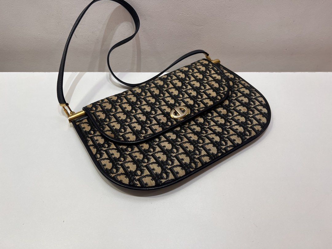 Vntage Dior Trotter Canvas Shoulder Bag (Category: Luxury Bags & Wallets) located in Cebu City. Submitted by brandedcorner_ph (Listing ID 1447114323, Image 3). Description: Pre-loved Vntage ((D))ior Trotter Canvas Shoulder Bag 100% Authentic or money back Condition • The item is in excellent condition with minimal signs of wear. The canvas shows a minor stain that is barely noticeable, making it perfectly presentable for daily wear. • Check all p