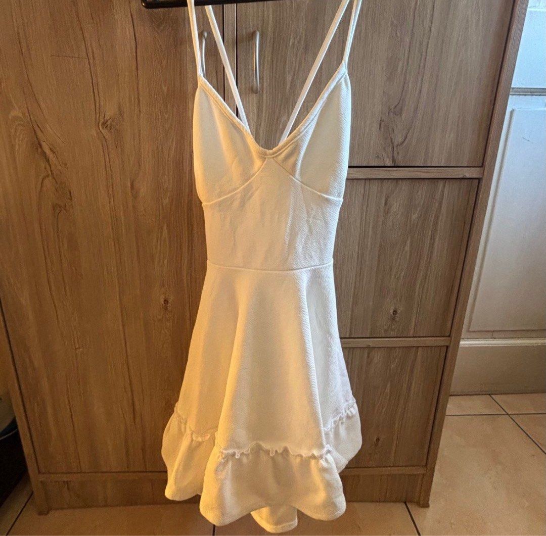 White Halter Neck Mini Dress with Tie Back (Category: Dresses) located in Silang. Submitted by declutterswuni (Listing ID 1447207474, Image 2). Description: - Cute white mini dress - Halter neck with tie-up back - Ruffled hem detail - Ideal for summer or beach vacation - Lightweight and easy to wear/style.