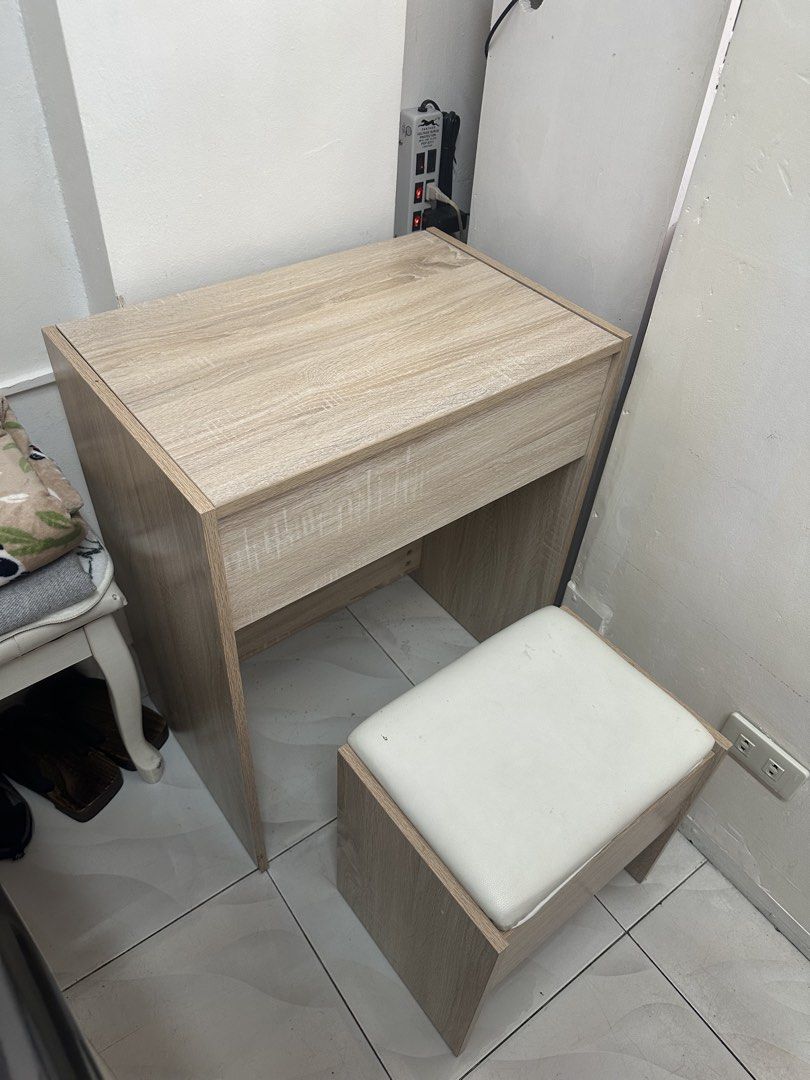 Wooden Vanity Table with Stool and Mirror (Category: Tables & Sets) located in Makati City. Submitted by yvanercii (Listing ID 1447145745, Image 2). Description: - Light wood vanity table with matching stool - Includes a mirror - Features a convenient storage drawer - Table dimensions: 60cm (L) x 40cm (W) x 75cm (H) - Stool dimensions: 40cm (L) x 28cm (W) x 40cm (H) - Ideal for bedrooms or dressing areas - Easy assembly.