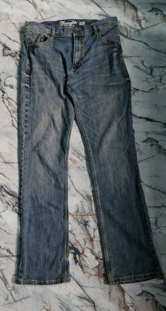 Wrangler Retro Slim Boot Jeans (Category: Jeans) located in Baguio. Submitted by kali_diego074 (Listing ID 1447128897, Image 3). Description: - Classic blue denim jeans from Wrangler - Retro slim boot cut style - Features iconic Wrangler stitching on back pockets - Button and zip closure - Ideal for everyday wear.