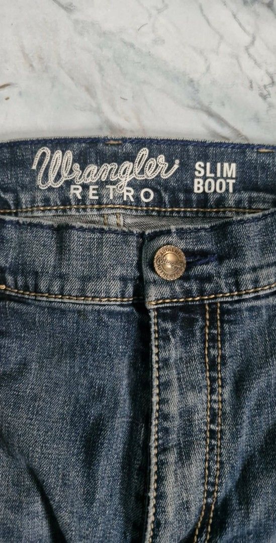 Wrangler Retro Slim Boot Jeans (Category: Jeans) located in Baguio. Submitted by kali_diego074 (Listing ID 1447128897, Image 1). Description: - Classic blue denim jeans from Wrangler - Retro slim boot cut style - Features iconic Wrangler stitching on back pockets - Button and zip closure - Ideal for everyday wear.