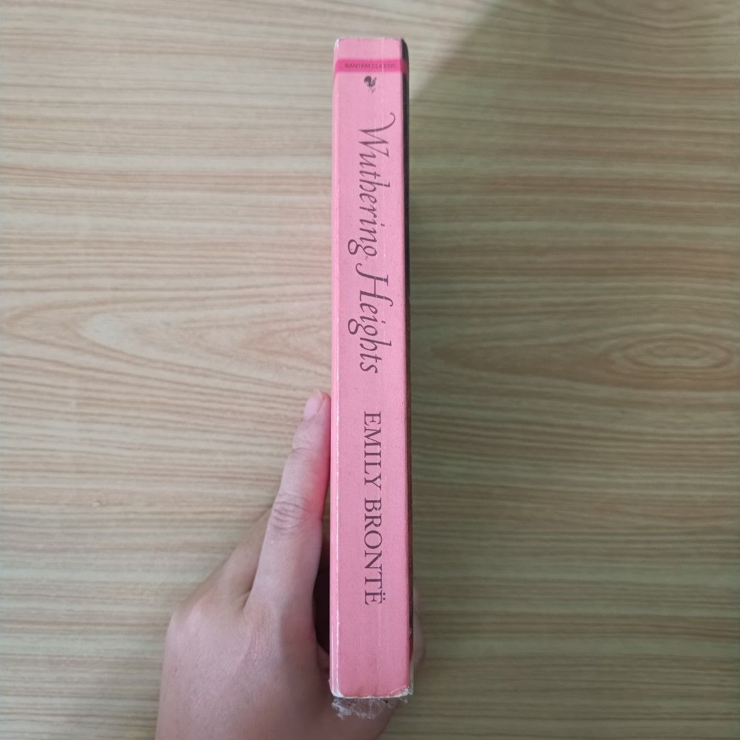 Wuthering Heights by Emily Brontë (Category: Storybooks) located in Manila. Submitted by asilayreadingbookstore (Listing ID 1447149043, Image 2). Description: - Classic novel: Wuthering Heights by Emily Brontë - Part of the Penguin Classics series - Pages show slight yellowing due to age - Cover has some signs of wear - A great read for literature enthusiasts.