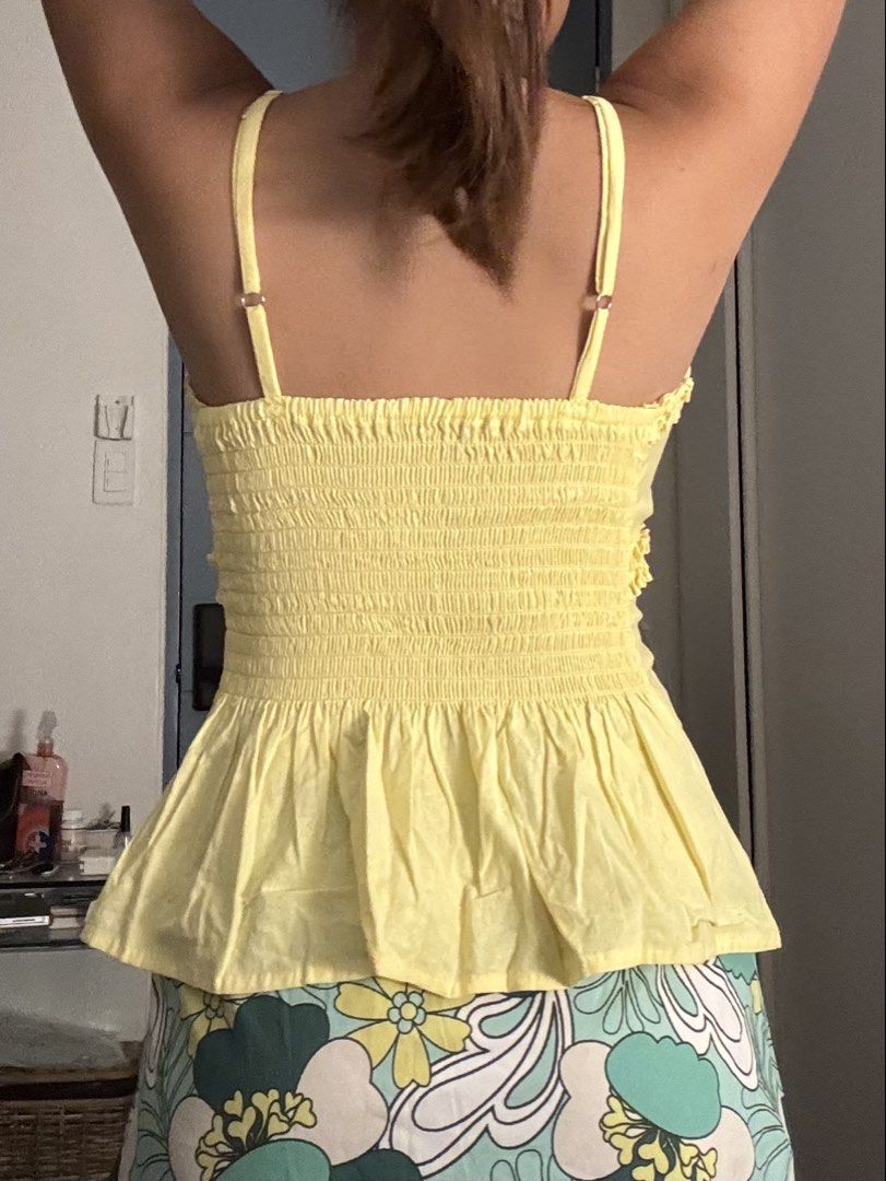 Yellow Ruffled Camisole Top with Smocked Back (Category: Sleeveless) located in Las Pinas. Submitted by fl0under_ (Listing ID 1447258318, Image 2). Description: - yellow camisole top - Smocked back for a comfortable, snug fit - Flattering peplum hem - Adjustable straps for a customized fit - Ideal for your summer wardrobe loc: las piñas.
