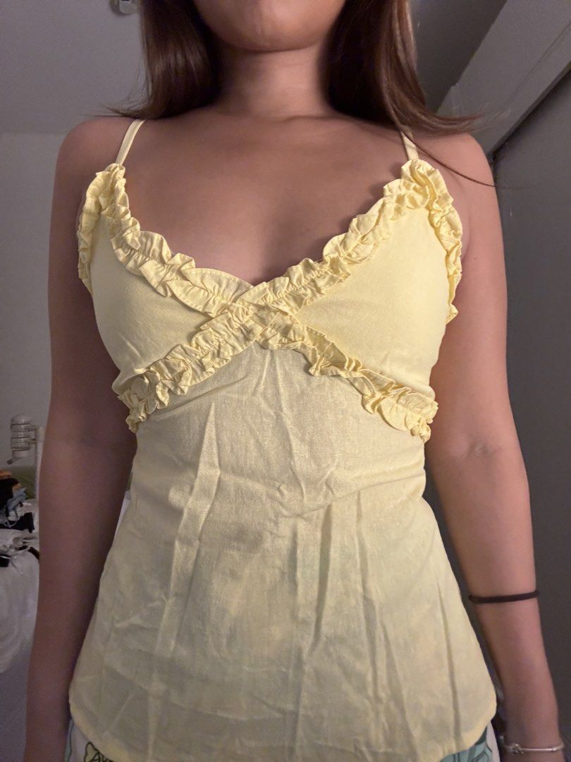 Yellow Ruffled Camisole Top with Smocked Back (Category: Sleeveless) located in Las Pinas. Submitted by fl0under_ (Listing ID 1447258318, Image 3). Description: - yellow camisole top - Smocked back for a comfortable, snug fit - Flattering peplum hem - Adjustable straps for a customized fit - Ideal for your summer wardrobe loc: las piñas.