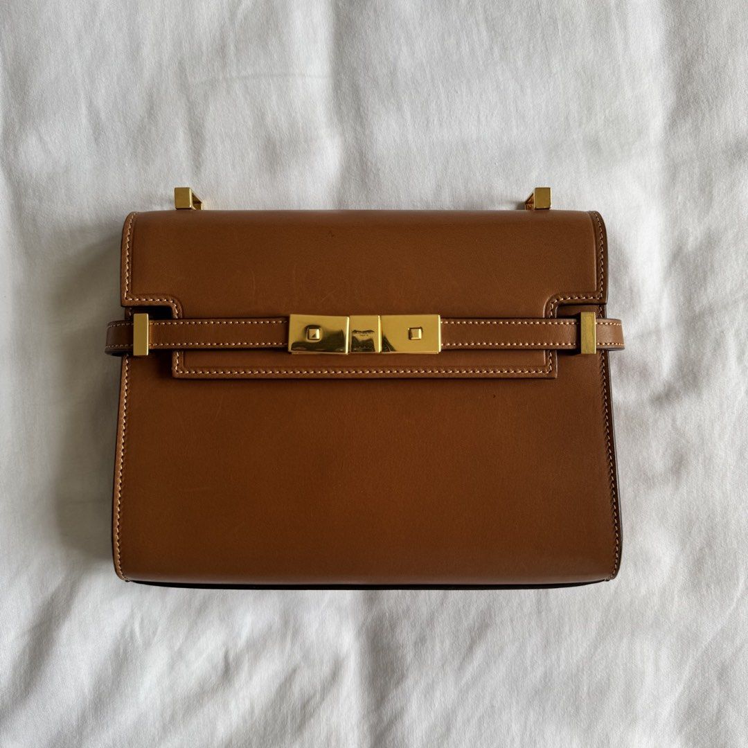 YSL Manhattan Mini (Category: Luxury Bags & Wallets) located in Quezon City. Submitted by usetheoxfordcomma (Listing ID 1447256470, Image 1). Description: See photos for condition and inclusions Leather has patina and light scratches; nothing major The bag in general has signs of wear, but it very much still looks great.