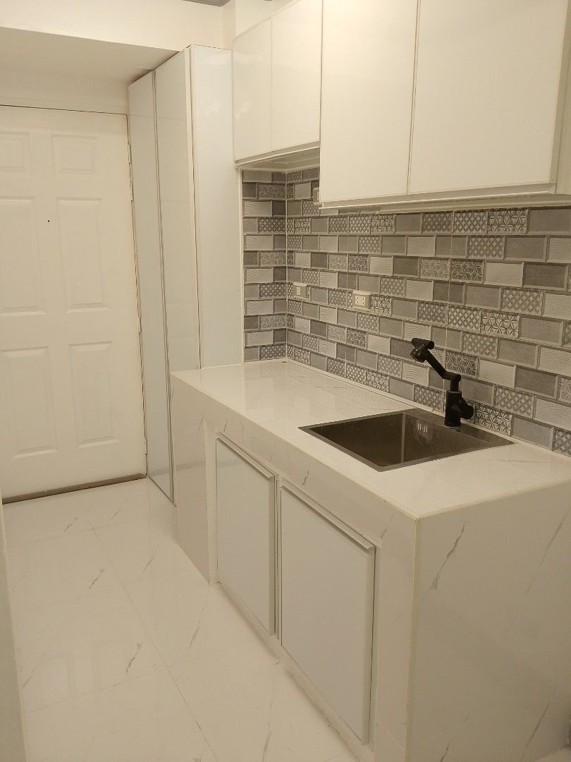 1BR condo unit Corinthian Executive Regency Condominium (Category: Apartments & Condos) located in Manila. Submitted by batchi1019 (Listing ID 1450824738, Image 1). Description: Newly renovated condo unit Features a sleek kitchen with modern appliances and a stylish backsplash. The bathroom is updated with a glass-enclosed shower and a rainfall showerhead. Spacious living area with a decorative ceiling light. Located in a convenient area. Ready f