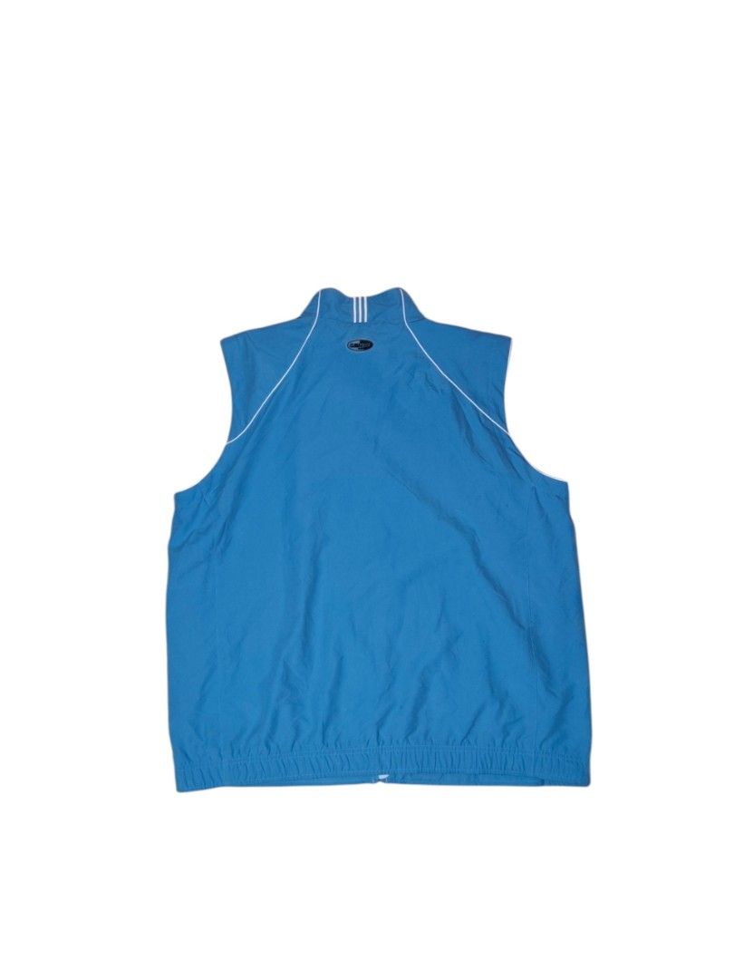 Adidas Blue Sleeveless Vest Jacket (Category: Vests) located in Taguig. Submitted by lloydyy_thrift (Listing ID 1450924165, Image 3). Description: - Blue Adidas vest - Full zip closure - Two side pockets - Lightweight material, ideal for layering or activewear - Adidas logo on front left - White piping detail along shoulders and collar -width 25 -length 28.