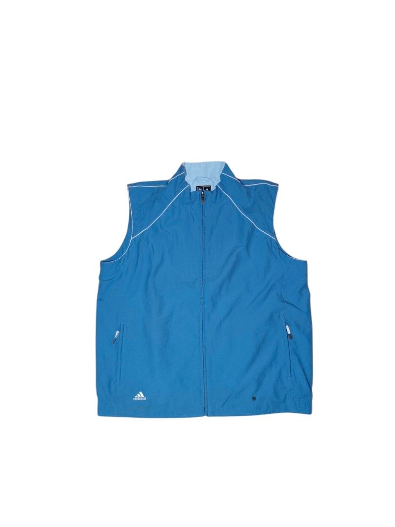 Adidas Blue Sleeveless Vest Jacket (Category: Vests) located in Taguig. Submitted by lloydyy_thrift (Listing ID 1450924165, Image 2). Description: - Blue Adidas vest - Full zip closure - Two side pockets - Lightweight material, ideal for layering or activewear - Adidas logo on front left - White piping detail along shoulders and collar -width 25 -length 28.