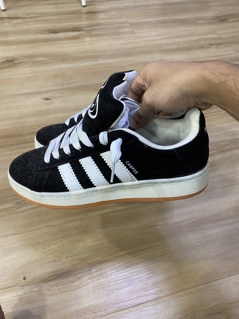 Adidas Campus (Category: Sneakers) located in Kuala Lumpur. Submitted by nazhanif77 (Listing ID 1450933580, Image 2). Description: - Classic Adidas Campus sneakers - Black suede upper with iconic white stripes - Durable gum sole for excellent grip - Size: uk9 - Made in Vietnam - Ideal for everyday casual wear.