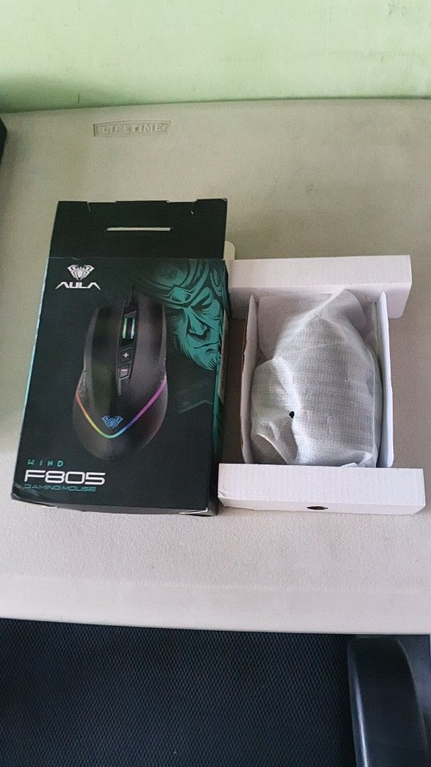 AULA F805 Gaming Mouse RGB (Category: Mouse & Mousepads) located in Manila. Submitted by nat-nd123 (Listing ID 1450806087, Image 2). Description: - AULA F805 Gaming Mouse - Color: Black - Features vibrant RGB lighting - Includes original box - Ideal for an enhanced gaming experience Used for 1 month only Original Shoppe Price - 450 RFS: Not Using Anymore.