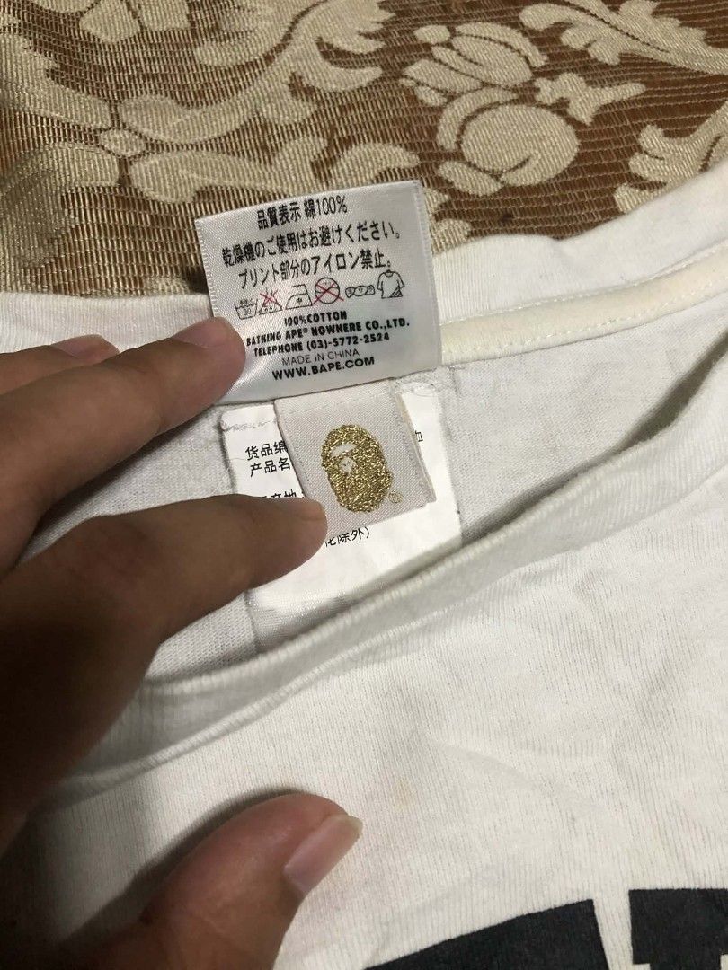 BAPE AAPE By A Bathing Ape T-Shirt (Category: Tshirts & Polo Shirts ) located in Manila. Submitted by rai_0413 (Listing ID 1450888955, Image 3). Description: - Brand: BAPE - Color: White - Size: S - Material: 100% Cotton - Style: Casual wear - Condition: Good - Features: Classic ape graphic with intricate details 19x23 need wash oil stain sign of usage neck 8.5 CR.