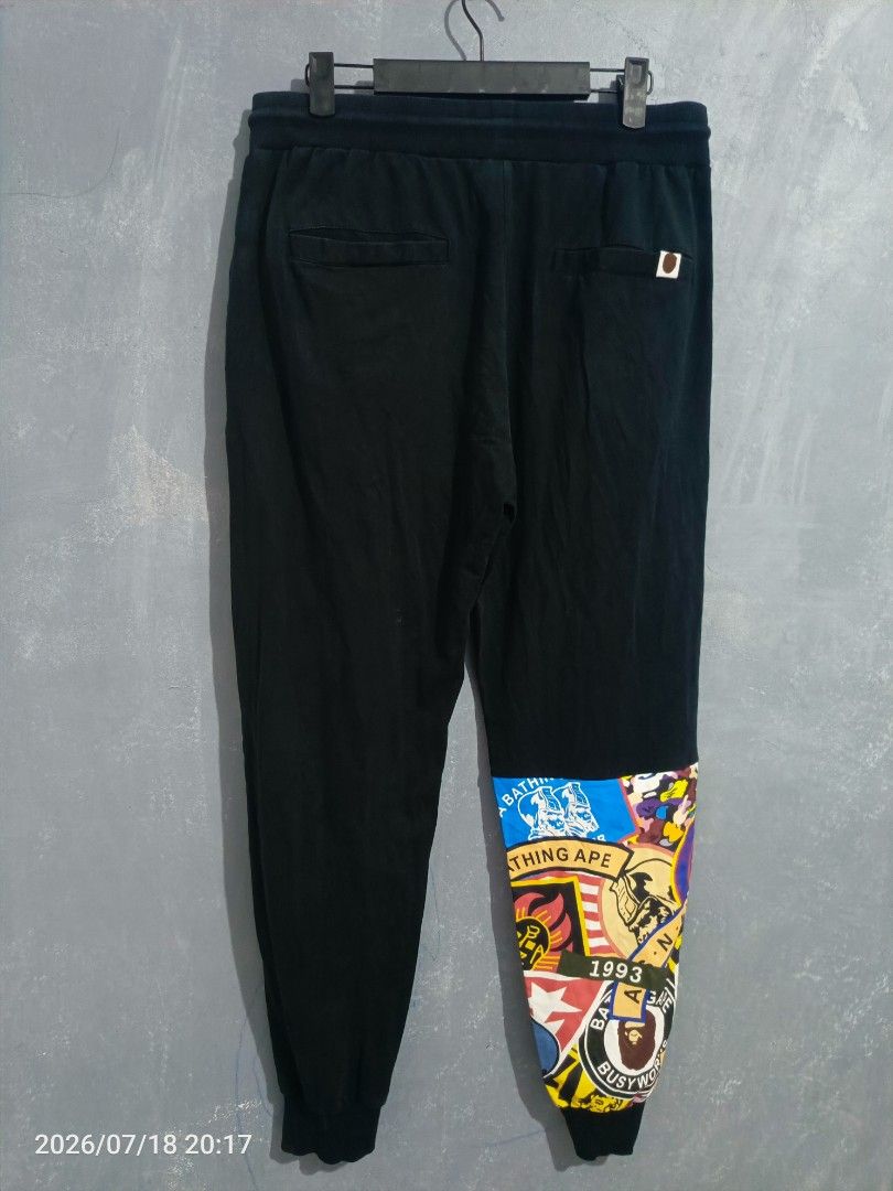 BAPE APE Busy Works Patchwork Jogger Pants (Category: Joggers) located in Iloilo. Submitted by wendxcz-thrift- (Listing ID 1450815700, Image 2). Description: OFF/LEGIT 🧐 - Brand: BAPE - Color: Black - Design: Iconic Busy Works patchwork on leg - Features: Elastic waistband with drawstring, ribbed cuffs - Style: Ideal for casual wear MOD: GCASH/BPI + SF.