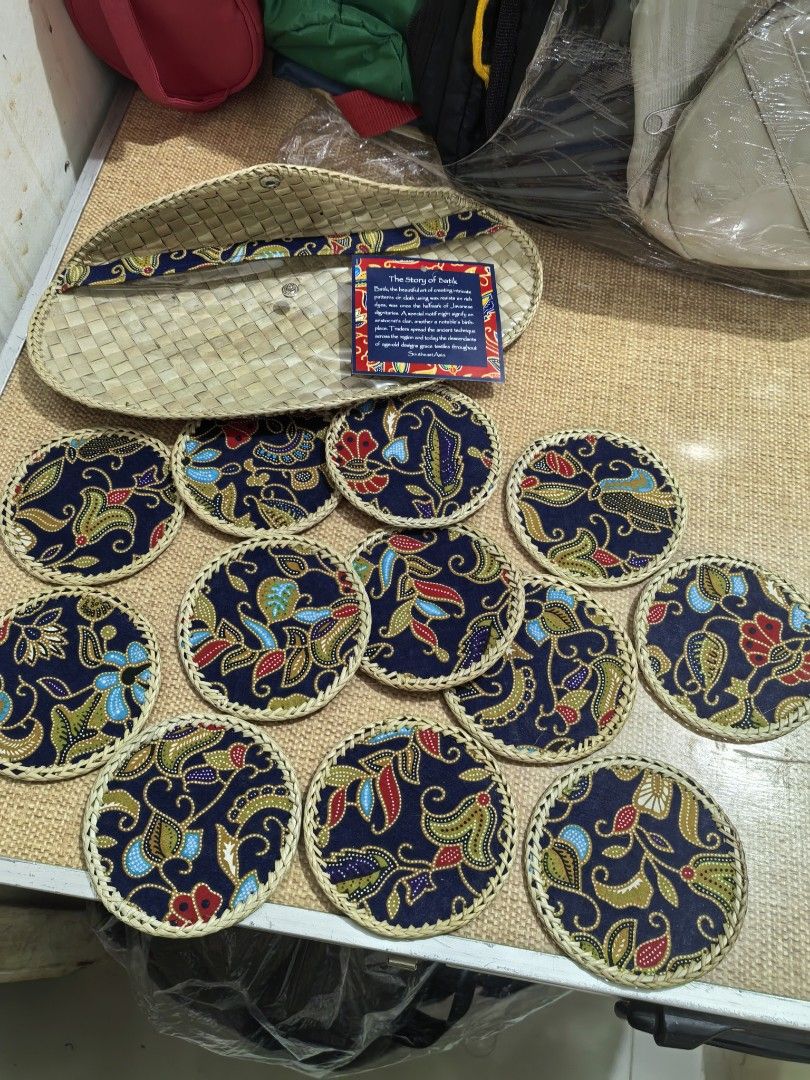 Batik Coaster Set 12 (Category: Other Kitchenware & Tableware) located in Cebu City. Submitted by dudes_villanueva (Listing ID 1450775515, Image 1). Description: Batik Coaster Set Brand New 12 Coasters inside. 📌 Features woven rattan construction with floral fabric tops and includes a matching envelope-style storage case. 📌 The set commonly contains 6 or 12 individual coasters, often sold as handmade souvenir items from Southeast Asia. 📌 The d