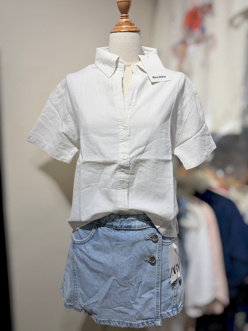 Bershka Short Sleeve Button Up Shirt - Multiple Colors (Category: Tshirts & Polo Shirts ) located in San Fernando. Submitted by mci.ph (Listing ID 1450836656, Image 3). Description: - Bershka short sleeve shirts - Available colors: Cream, Black, White, Grey - Button-up style with collar - Relaxed fit - Ideal for casual wear or layering.