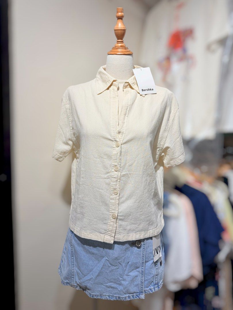 Bershka Short Sleeve Button Up Shirt - Multiple Colors (Category: Tshirts & Polo Shirts ) located in San Fernando. Submitted by mci.ph (Listing ID 1450836656, Image 1). Description: - Bershka short sleeve shirts - Available colors: Cream, Black, White, Grey - Button-up style with collar - Relaxed fit - Ideal for casual wear or layering.