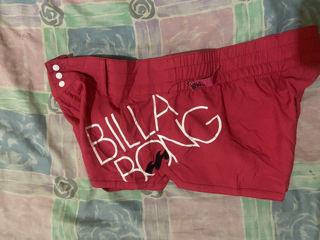 Billabong Pink Board Shorts Size 12 (Category: Swim Trunks & Board Shorts) located in Don Carlos. Submitted by doubleethrifted (Listing ID 1450822565, Image 2). Description: - Pink Billabong board shorts - Size 12 - 100% Polyester with stretch fabric - Billabong logo detail on the side - Elastic waistband with drawstring and button closure - Ideal for swimming and beach activities.