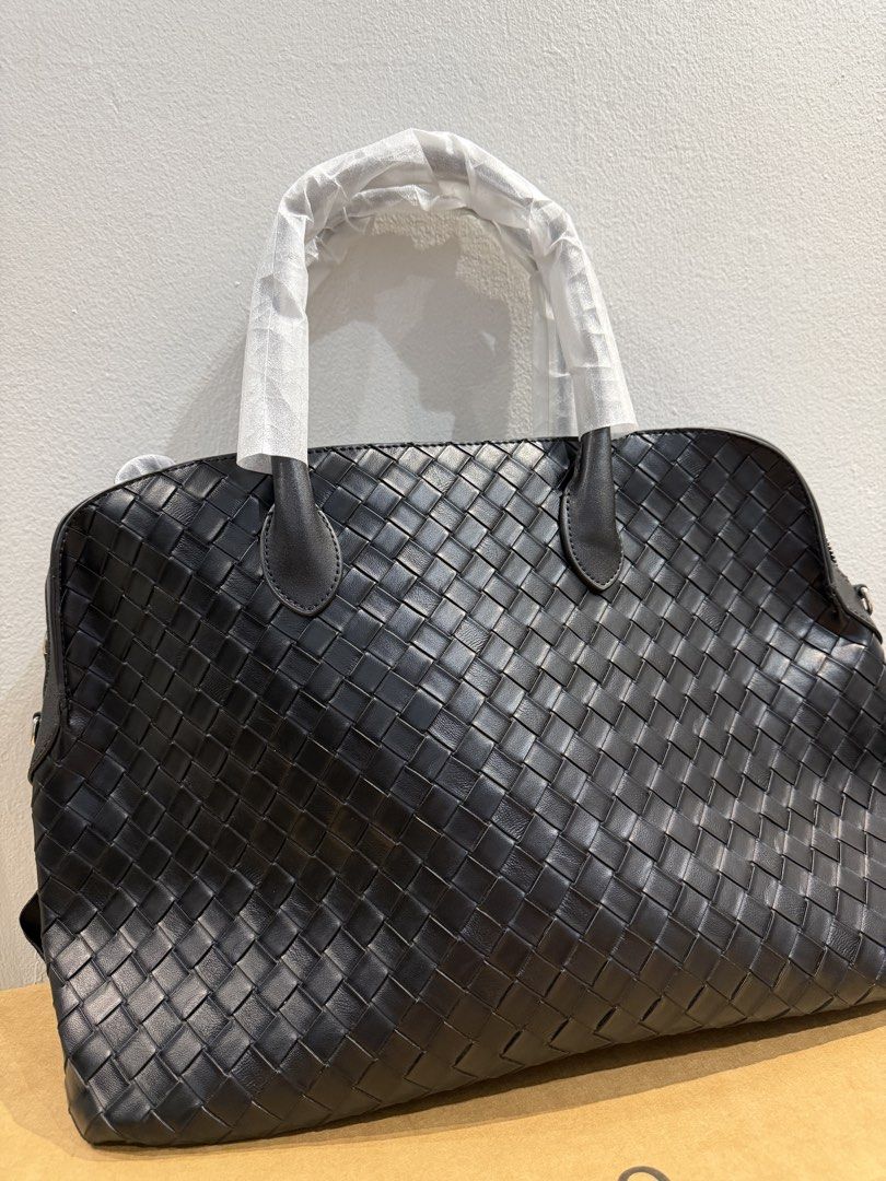 Black Woven Leather Handbag with Shoulder Strap (Category: Shoulder Bags) located in Bulacan. Submitted by surewinstuff (Listing ID 1450927672, Image 3). Description: - Stylish black woven leather handbag - Genuine cowhide leather - Includes a detachable shoulder strap for versatility - Brand new, with box - Features a spacious interior, ideal for travel or everyday essentials - Dimension: L42xW15xH28 cm - Bought it at 3300 pesos - RFS: declutter