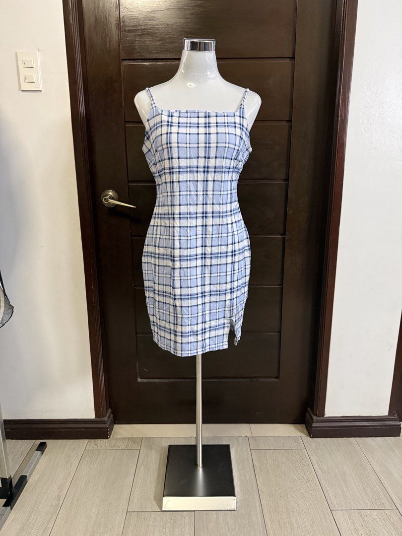 Blue Plaid Mini Dress with Spaghetti Straps (Category: Dresses) located in Quezon City. Submitted by soloqueenph (Listing ID 1450782809, Image 1). Description: Cute blue and white plaid mini dress. Features thin spaghetti straps and a square neckline. Has a small slit on the side. Great for a casual day out or a summer party. Easy to style with sneakers or sandals..