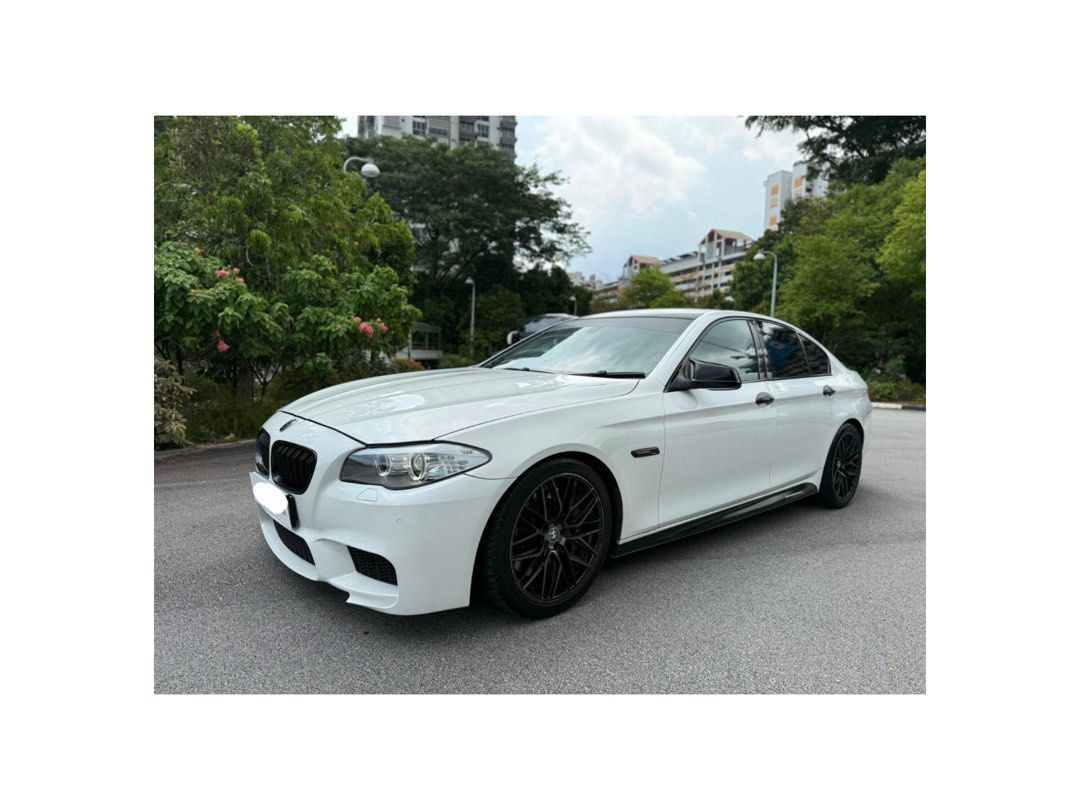 BMW 5 Series Sedan 523i 2.5 (A) (Category: Used Cars) located in Singapore. Submitted by swspareparts (Listing ID 1450874202, Image 2). Description: White BMW 5 Series sedan. $0 downpayment Monthly $1300+ New aircon compressor. Wear and tear all done up! Aftermarket valvetronic on off exhaust Stock exhaust provided Carbon fiber steering wheel Ps5 tyres Ambient lighting Upgraded android system with apply car play Upgraded bodykit Sports rims Conta