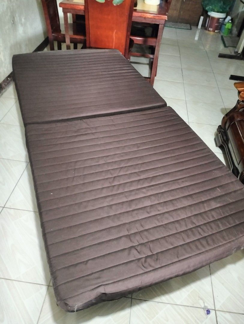 Japan Folding Bed with Mattress (Category: Bed Frames & Mattresses) located in Santa Rosa. Submitted by wawawiwao (Listing ID 1450769485, Image 1). Description: - Brown folding bed - Comfortable mattress with ribbed design - Folds up for easy storage - Metal frame - Wheels for easy mobility - Ideal for guests or small living spaces - Can also recline Loc : Santa Rosa Laguna.