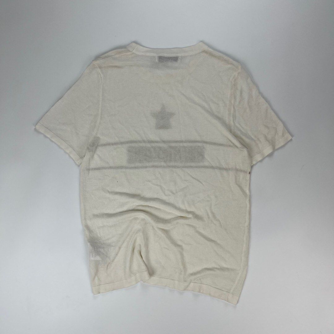 Christian Dior White Star Logo KNITTED (Category: Tshirts & Polo Shirts ) located in Iloilo. Submitted by anonymous_ph (Listing ID 1450767798, Image 2). Description: - Authentic Christian Dior T-Shirt - Size: 6 US - Color: White - Design: Features iconic star and logo detail - Material: Luxurious blend of Linen, Cashmere, Silk, Polyamide, and Lycra - Origin: Made in Italy - Condition: Great piece for any Dior fan (OPEN SIZE) -WIDTH 16.5 -LENGTH 2