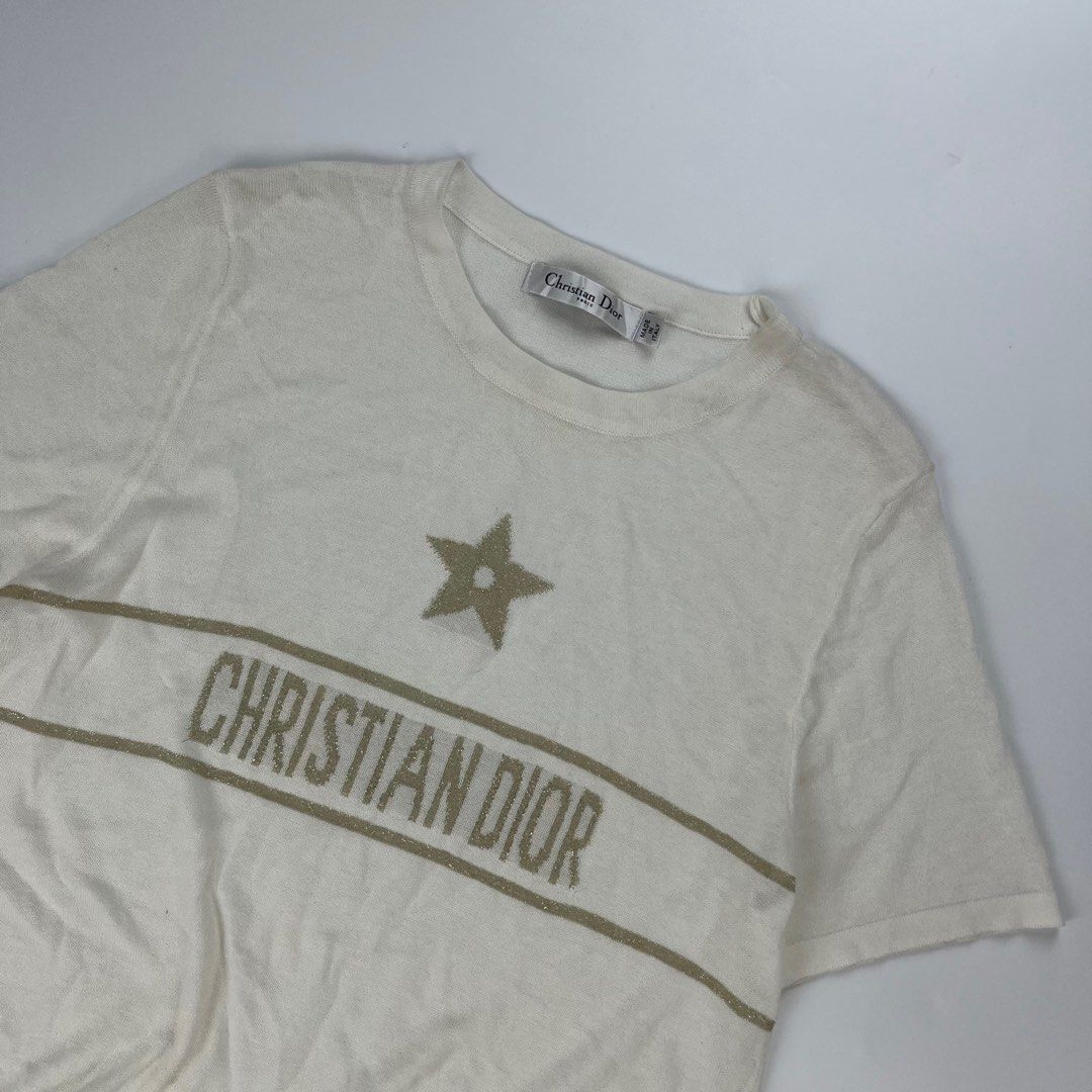 Christian Dior White Star Logo KNITTED (Category: Tshirts & Polo Shirts ) located in Iloilo. Submitted by anonymous_ph (Listing ID 1450767798, Image 3). Description: - Authentic Christian Dior T-Shirt - Size: 6 US - Color: White - Design: Features iconic star and logo detail - Material: Luxurious blend of Linen, Cashmere, Silk, Polyamide, and Lycra - Origin: Made in Italy - Condition: Great piece for any Dior fan (OPEN SIZE) -WIDTH 16.5 -LENGTH 2