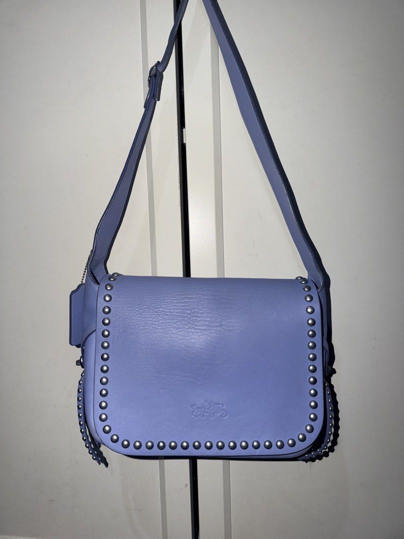 Coach Rivets Dakotah (35753) in Periwinkle (Category: Cross-body Bags) located in Manila. Submitted by halm3r (Listing ID 1450850114, Image 1). Description: Coach Rivets Dakotah (35753) in Periwinkle With hangtags With light stains on the suede part Clean interior See photos for details Loc: Sta.Mesa.