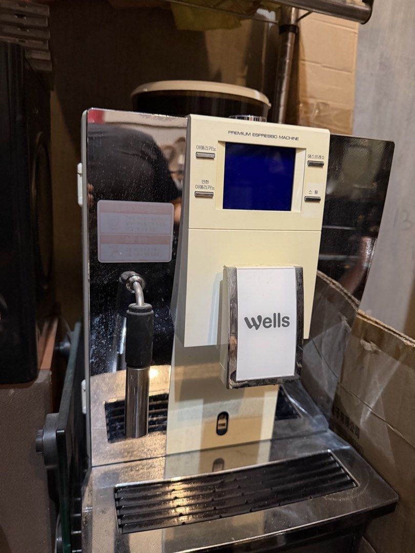Wells Automatic Coffee Machine (Category: Coffee Machines & Makers) located in Bulacan. Submitted by mysticdeer.6d7f47 (Listing ID 1450890735, Image 3). Description: This is a Wells premium espresso machine (model KW-E01W1) designed to create espresso and Americano beverages with a bean container capacity of 350g.The machine features a digital display and options for direct water line connection or a 2-liter water tank.It has dimensions of approx